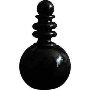 Kindred Black Ishpingo Om parfüm şişesi