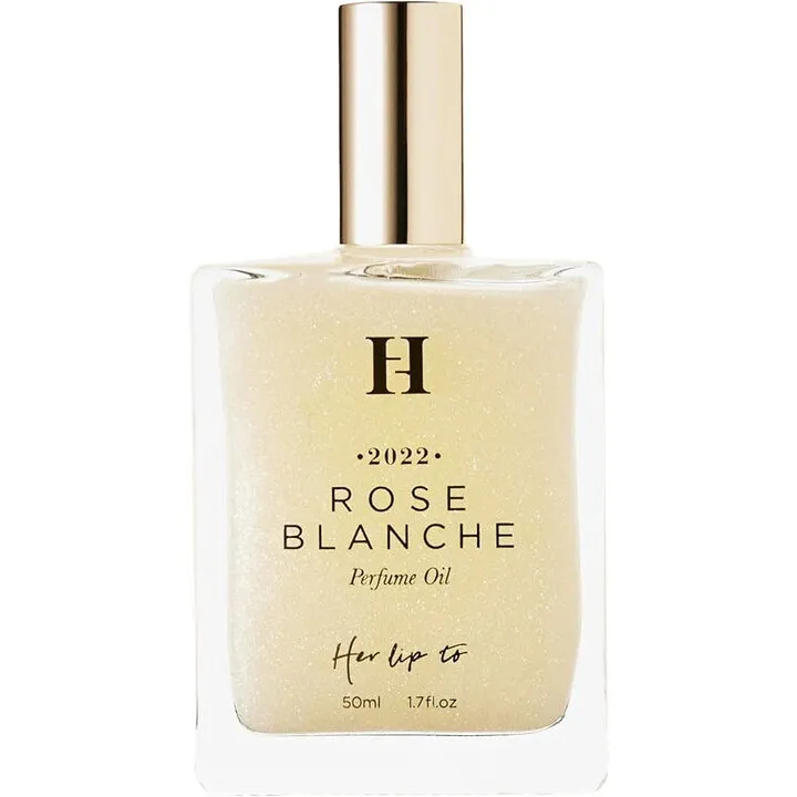 Her lip to BEAUTY Rose Blanche (Perfume Oil) perfume bottle